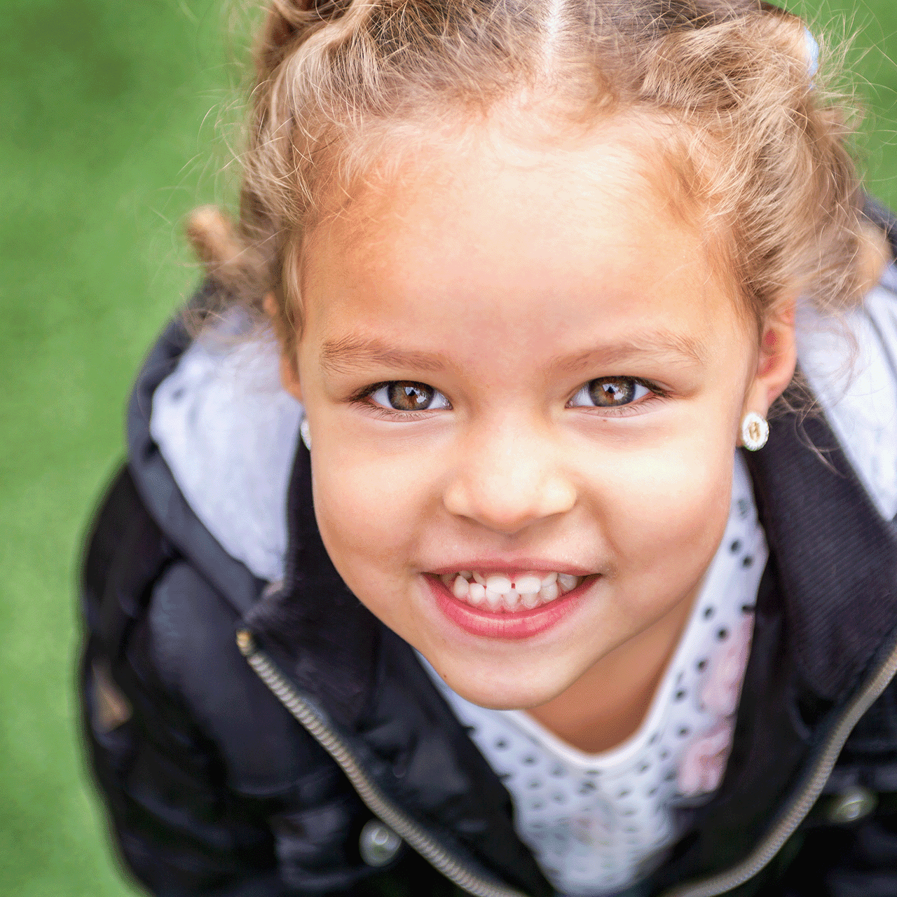 little girl looking into lens