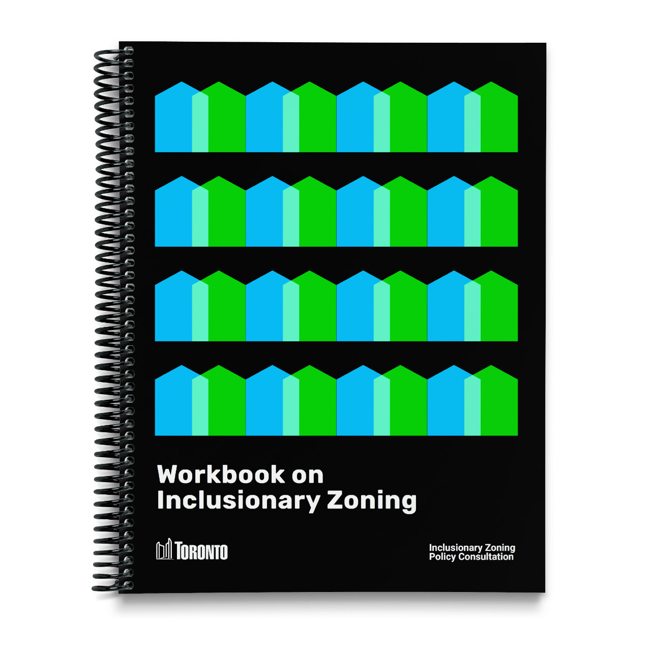 A black notebook with blue and green graphic pattern in the shape of houses and a 'workbook on inclusionary zoning' title
